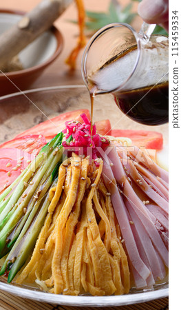 Summer dish: chilled Chinese noodles served on a cool transparent plate Summer dish: chilled Chinese noodles served on a cool transparent plate 115459334