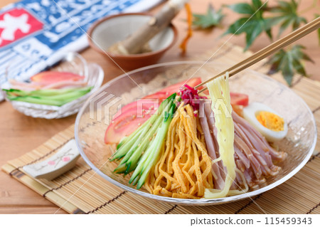 Summer dish: chilled Chinese noodles served on a cool transparent plate Summer dish: chilled Chinese noodles served on a cool transparent plate 115459343