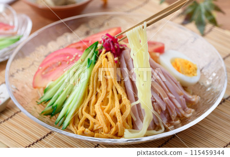 Summer dish: chilled Chinese noodles served on a cool transparent plate Summer dish: chilled Chinese noodles served on a cool transparent plate 115459344