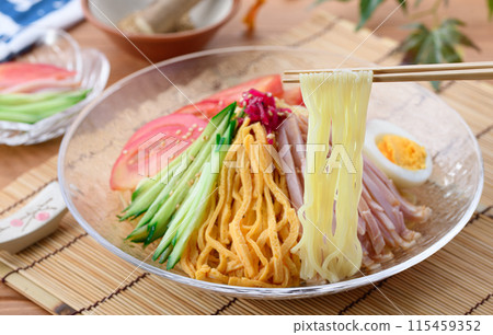 Summer dish: chilled Chinese noodles served on a cool transparent plate Summer dish: chilled Chinese noodles served on a cool transparent plate 115459352