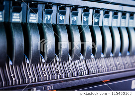 Row of hard disks used for data storage in internet data center Row of hard disks used for data storage in internet data center 115460163