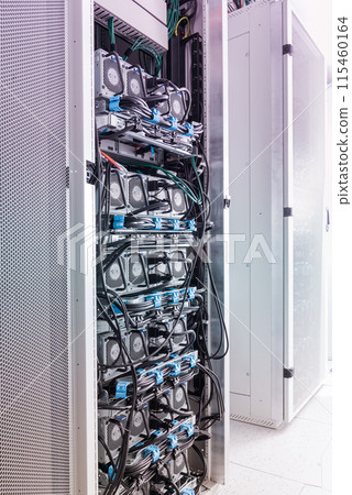 A row of racks with data storage hardware inside server room A row of racks with data storage hardware inside server room 115460164
