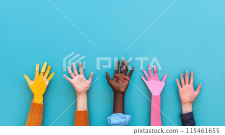 Colorful cut out paper hands of different skin colors reaching up on a blue background. Colorful cut out paper hands of different skin colors reaching up on a blue background. 115461655