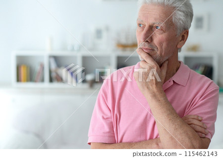 close-up portrait of a senior man thinking about something close-up portrait of a senior man thinking about something 115462143