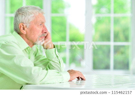 close-up portrait of a senior man thinking about something 115462157