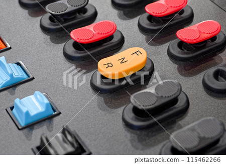 Black control panel with accorted buttons and switches Black control panel with accorted buttons and switches 115462266