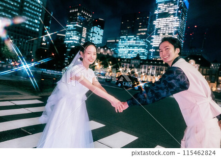 A couple enjoying a photo wedding at Tokyo Station at night A couple enjoying a photo wedding at Tokyo Station at night 115462824