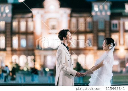 A couple enjoying a photo wedding at Tokyo Station at night A couple enjoying a photo wedding at Tokyo Station at night 115462841
