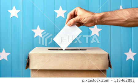 Hand Casting Ballot into Voting Box with Starry Background 115462892