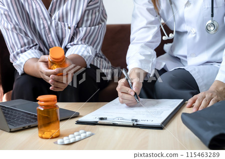 Female doctors who treat patients make an appointment to listen to the results after a physical examination and explain medical information and diagnose the disease. Medical concepts and good health 115463289