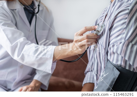 The female doctor measured blood pressure, the patient examined the heartbeat, and sat down to talk about health care closely. health care concept 115463291