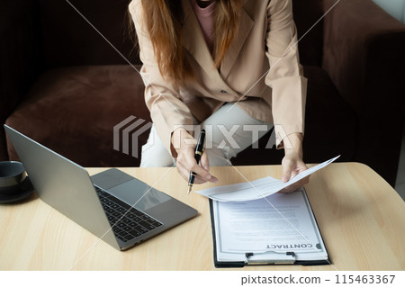 Business woman employer holding resume hiring recruit looking cv resume to hire candidates, analyzing information before job interview. Recruitment concepts Business woman employer holding resume hiring recruit looking cv resume to hire candidates, analyzing information before job interview. Recruitment concepts 115463367
