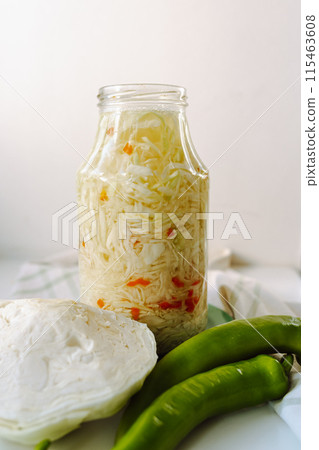 homemade fermented cabbage with spices, hot chili pepper 115463608