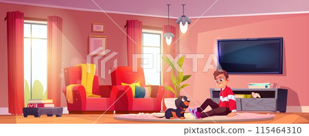 Kid boy playing with dachshund dog at home 115464310