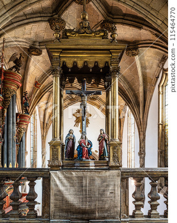 Gold gleeming Manueline choir stalls at Mosteiro de Santa Cruz monastery at Coimbra, Portugal 115464770