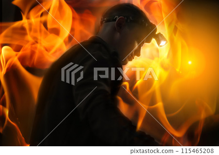 Silhouette of a firefighter going out into the fire. Banner, poster for international firefighters day. Brave firefighter in action, firefighting hero Silhouette of a firefighter going out into the fire. Banner, poster for international firefighters day. Brave firefighter in action, firefighting hero 115465208