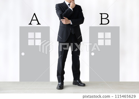 Image of a businessman standing at a turning point Image of a businessman standing at a turning point 115465629