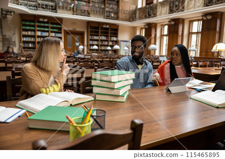 Young people in the library, blonde woman talking on the phone 115465895