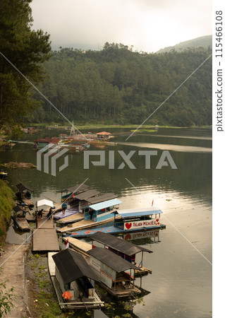 the boat is moored near the river 115466108