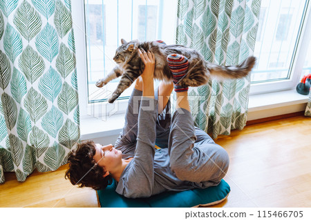 portrait young woman doing yoga with cat 115466705