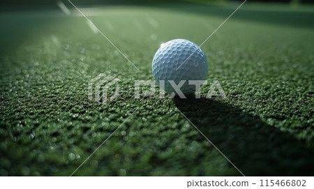 A close-up shot of golf ball up in the air after the shot, focus on the ball from above of the golf court 115466802