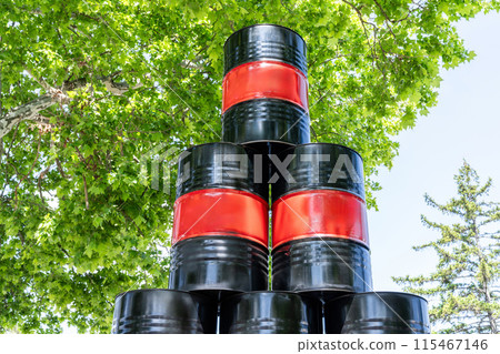 Stack of drums with black and red stripes. Mock up. 115467146