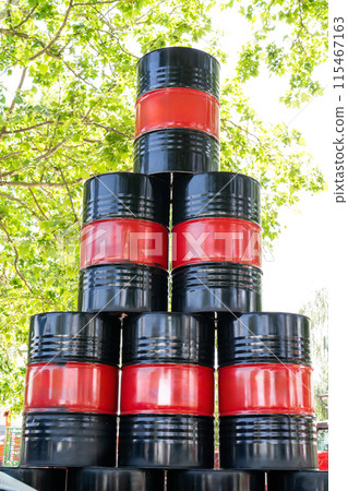Stack of drums with black and red stripes. Mock up. 115467163