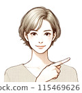 A woman with short hair wearing a beige cut-and-sew top points and explains something 115469626