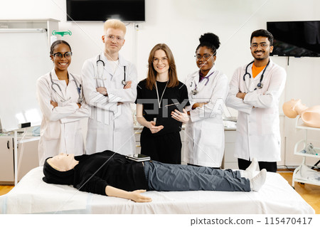 Medical Students Practicing CPR on a Training Dummy Medical Students Practicing CPR on a Training Dummy 115470417
