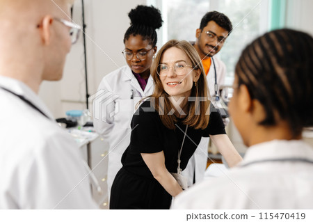 Medical Students Discussing Patient Care in a Classroom 115470419