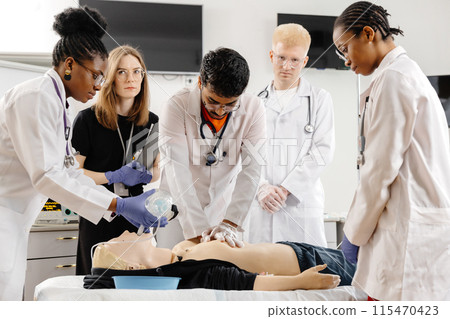 Medical Students Practicing CPR on a Dummy 115470423