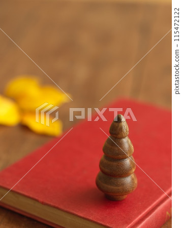 Tabletop Christmas tree and foreign books Christmas image 115472122