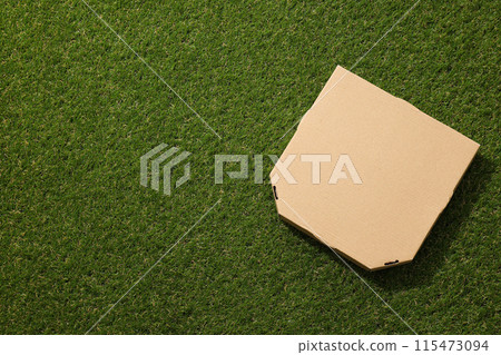 Ecological packaging for food delivery, on the grass. Ecological packaging for food delivery, on the grass. 115473094