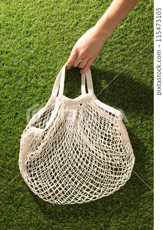 Eco bag, reusable, for shopping, on grass. Eco bag, reusable, for shopping, on grass. 115473105
