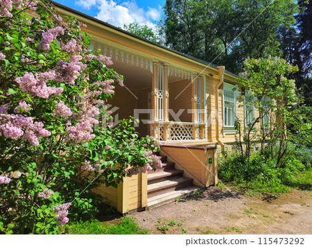 Beautiful the porch steps to veranda in old wooden houses and blooming lilac Beautiful the porch steps to veranda in old wooden houses and blooming lilac 115473292