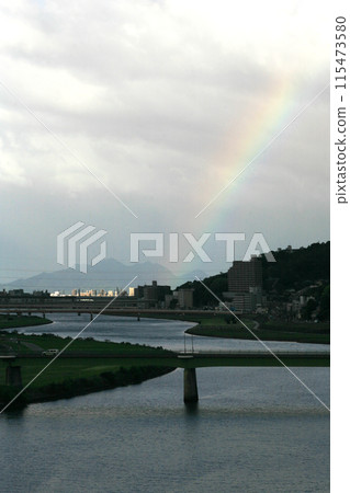 Morning rainbow over the river 115473580