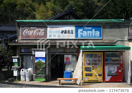 A shop in front of a local train station 115473678
