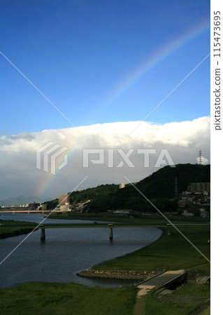 Morning rainbow over the spillway 115473695