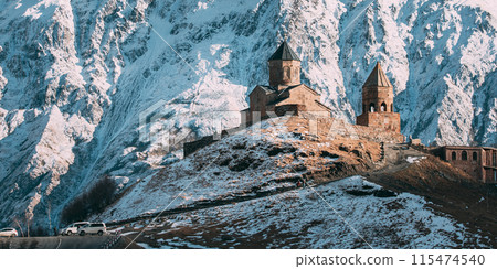 Stepantsminda, Georgia. Famous Gergeti Trinity Tsminda Sameba Church In Early Winter 115474540