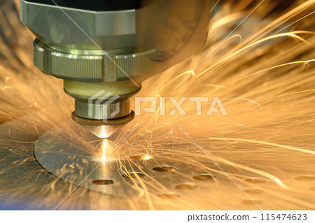 The fiber laser cutting machine  cut the metal plate with the sparkling light. 115474623