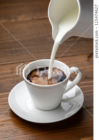 Put milk in coffee 115474627