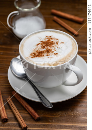 Cappuccino on a wooden table 115474641