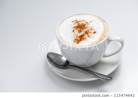 Coffee cup cappuccino and spoon on white background 115474642