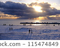 First sunrise seen from the winter coast 115474849