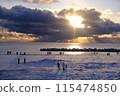 First sunrise seen from the winter coast 115474850