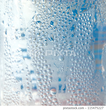 Water droplets texture on blue background Water droplets texture on blue background 115475227