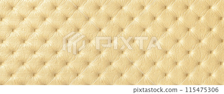 Texture of light golden leather background with capitone pattern, macro. Yellow textile of retro Chesterfield style. Texture of light golden leather background with capitone pattern, macro. Yellow textile of retro Chesterfield style. 115475306