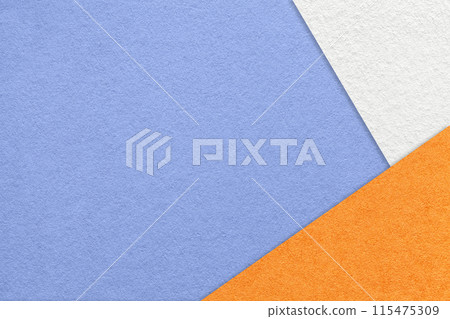Texture of craft very peri color paper background with white and orange border. Vintage abstract blue cardboard. 115475309