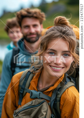 A family hiking in nature together enjoys an outdoor adventure. A family hiking in nature together enjoys an outdoor adventure. 115477017