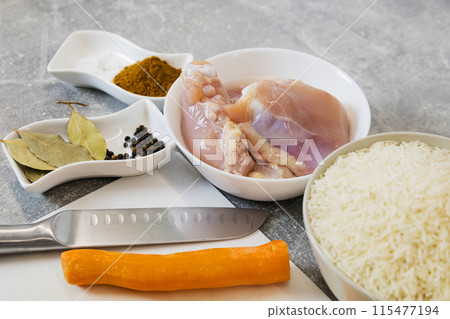 The chef prepares homemade crispy fried chicken with carrots and onions, spices. The chef prepares homemade crispy fried chicken with carrots and onions, spices. 115477194